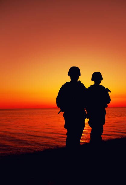 istock Coast guard soldiers team patrolling seacoast 1305492571