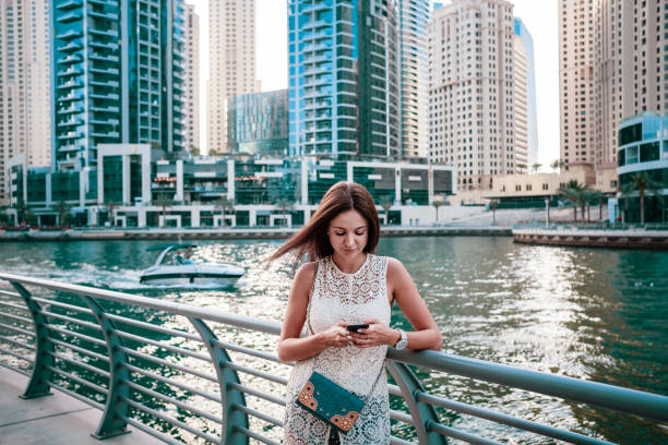 istock Attractive female traveller sharing photos from journey 1305495008