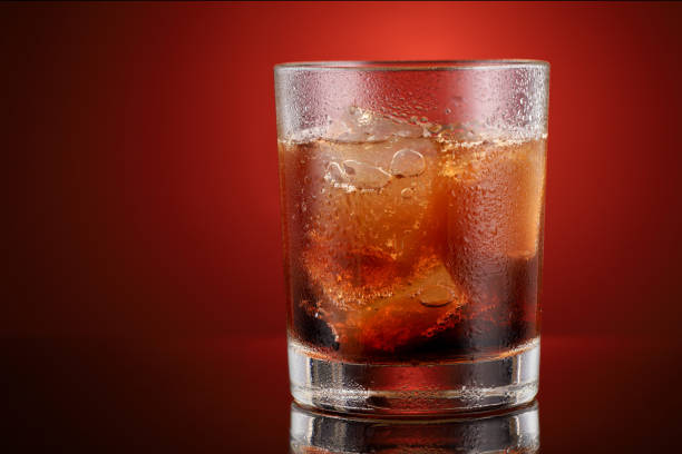 Soft drink with ice in a glass place for text cope space.