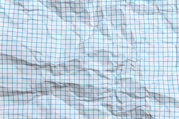 istock Background, texture of a crumpled notebook sheet with grid-like markings 1305496676
