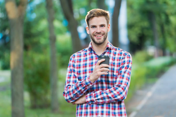 happy man with coffee cup on street wear checkered shirt, drinks and people - business styles foods and drinks drinking imagens e fotografias de stock