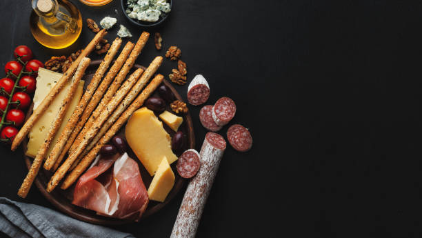 istock Italian appetizers on dark background 1305496990