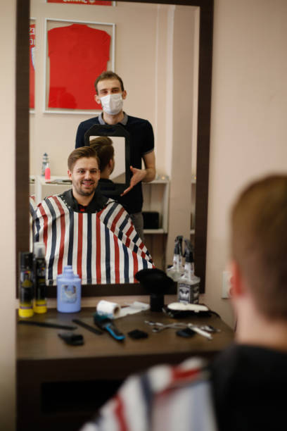 istock Young Man at the Barber stock photo 1305499005