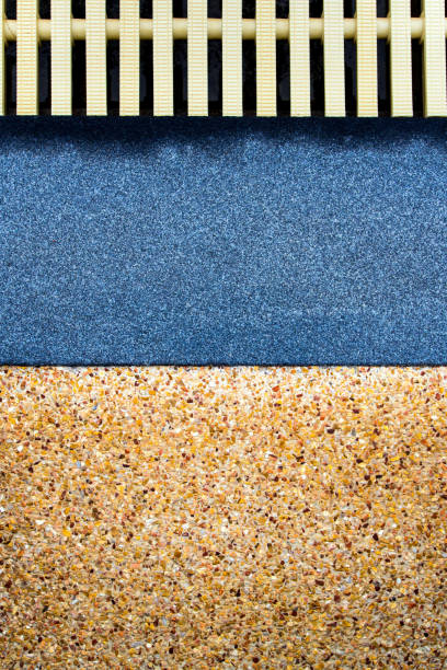 istock The surface texture on the joint of the different non slip flooring and the plastic gutter cover beside the pool 1305500522