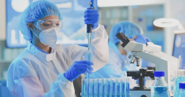istock asian scientist take test tube 1305502502