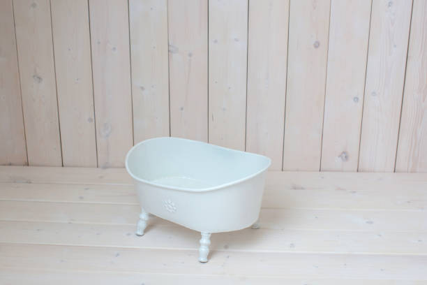istock Bath on a wooden background. 1305502735