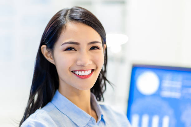 istock office worker smile at you 1305502990