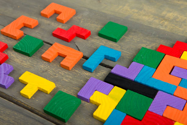 istock Creative solution for idea - business concept, jigsaw puzzle on the wooden desk 1305504331