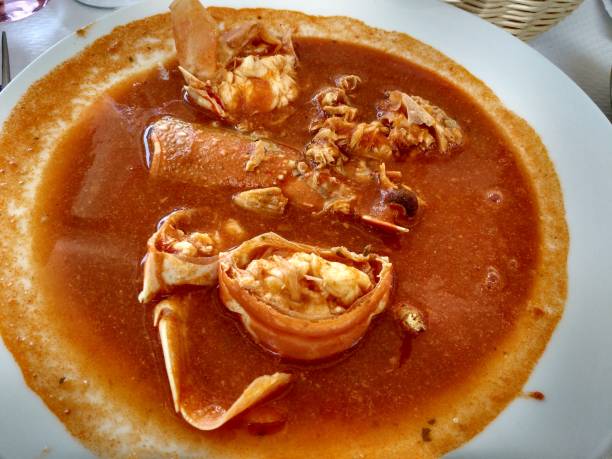 'Caldereta de langosta', lobster stew, a typical meal in Fornells village, Menorca, Spain Caldereta is one of the typical meals in the area of Fornells city minorca photos stock pictures, royalty-free photos & images