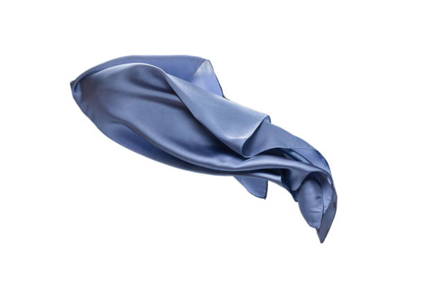 istock Flowing blue silk scarf isolated on white background. 1305506654