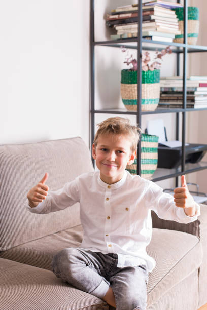 istock Vlogger recording social media video while sitting on the couch 1305507771