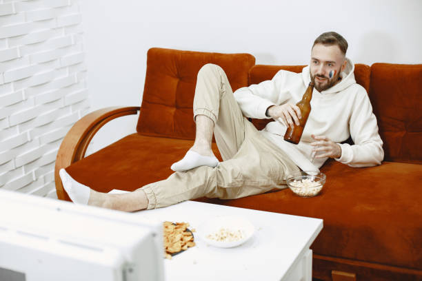 istock Man watching a soccer moment on the TV 1305508439
