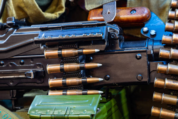 istock Green ammunition box with machine-gun belt isolated 1305511121
