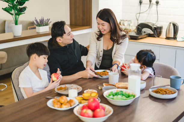 istock An Asian family having breakfast at home 1305511263