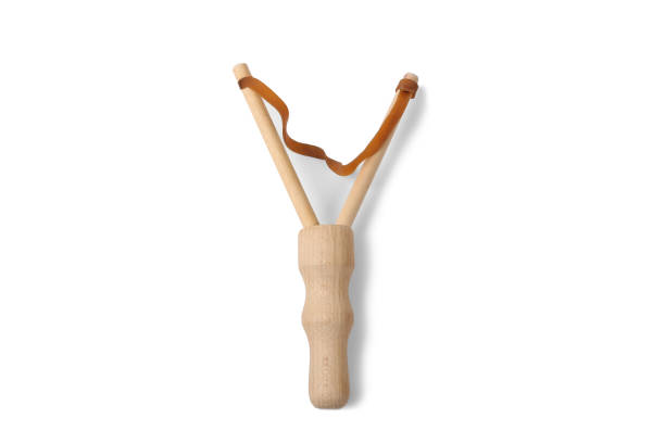 istock Wooden slingshot isolated on a white background. 1305511408