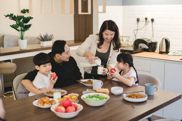 istock An Asian family having breakfast at home 1305511711