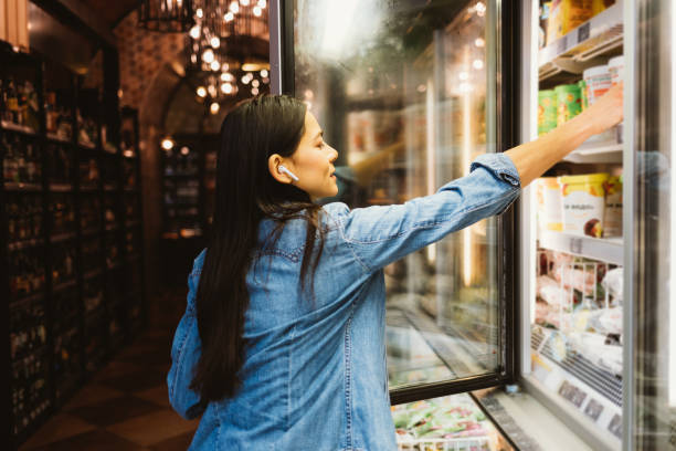 istock Young beautiful woman choosing products 1305512721