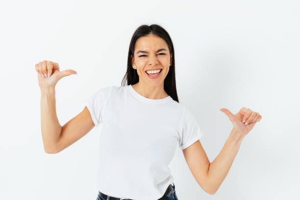 istock Cheerful successful young woman pointing at herself with thumbs 1305512740