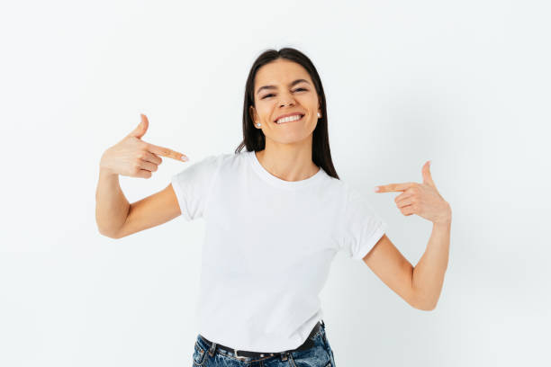 istock Happy confident young brunette woman pointing at herself 1305512773