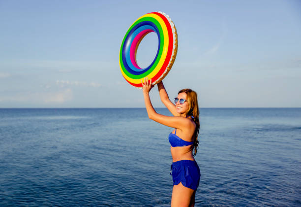 istock Playful woman on the beach 1305512846