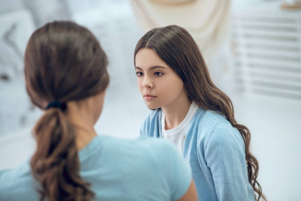 istock Attentive listening daughter looking at mom 1305514138