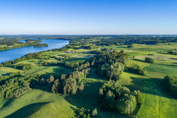 istock A large lake with blue water surrounded by numerous hills, forests and fields on the landscape from a drone. 1305514439