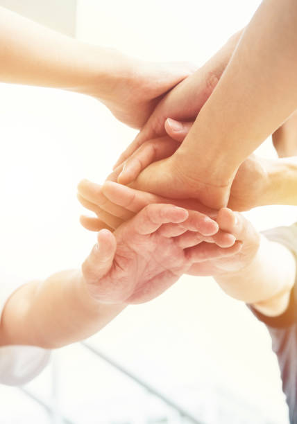 istock Together collaborate of hands teamwork outdoor 1305515454