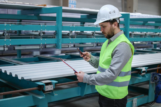 istock The Engineer Working in The Factory Controls The Machines 1305518293