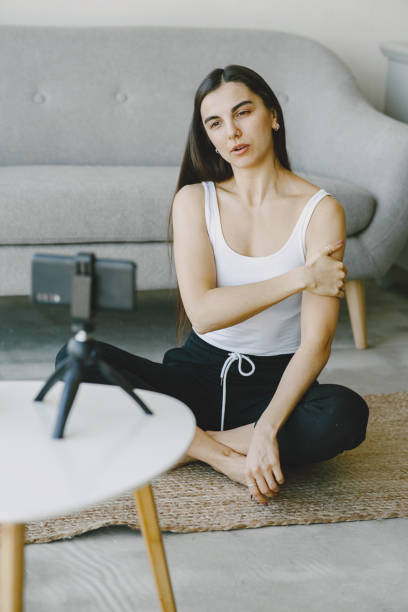istock Woman talking on video communication at home near sofa 1305518490