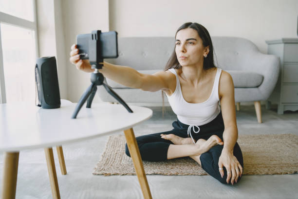 istock Woman talking on video communication at home near sofa 1305518510