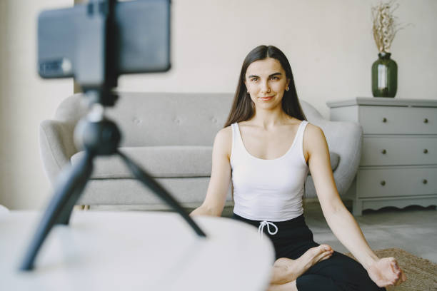 istock Woman talking on video communication at home near sofa 1305518515