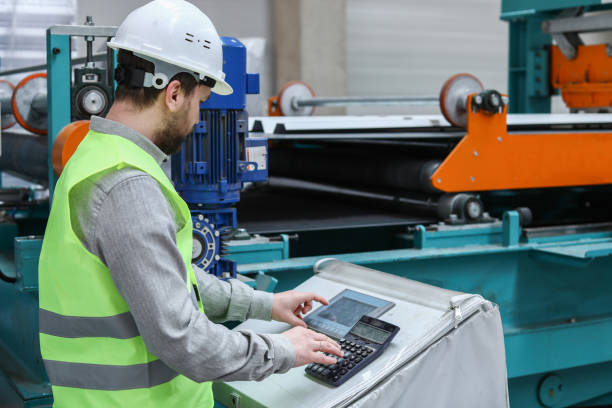 istock The Engineer Working in The Factory Controls The Machines 1305518620