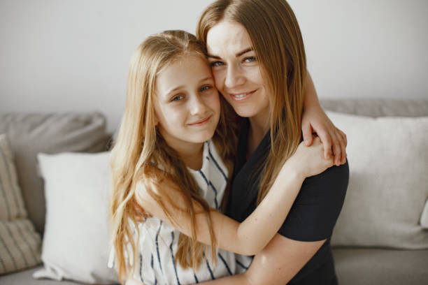 istock Happy mom and daughter hug and spend time together 1305520806