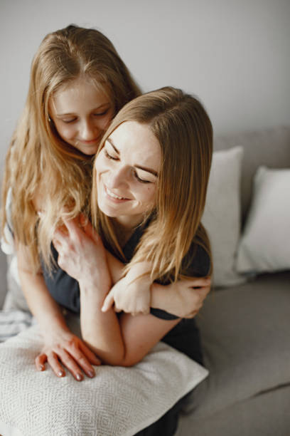 istock Happy mom and daughter hug and spend time together 1305520807