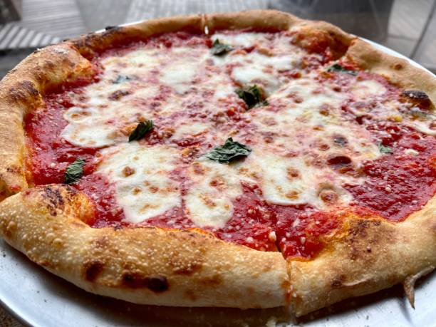 istock pizza margarita with cheese close-up 1305520841
