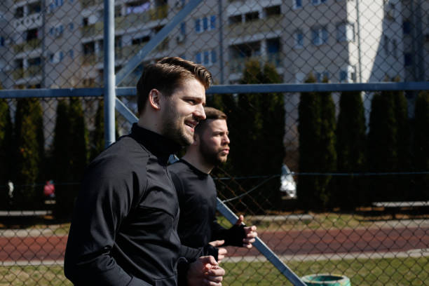 istock Two young friends training outdoors. stock photo 1305522617