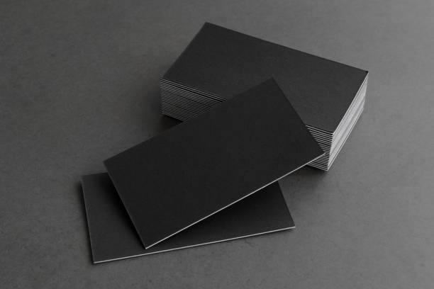 istock Business card on black background. 1305522682