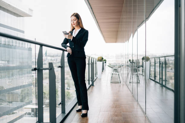 istock Businesswoman using smartphone during break 1305525246