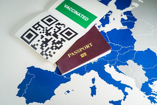Digital green passport with QR code over an EU map.The European Union will propose issuing a certificate called a Digital Green Pass