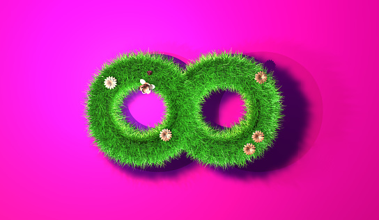 An infinity symbol made of grass on a pink background.