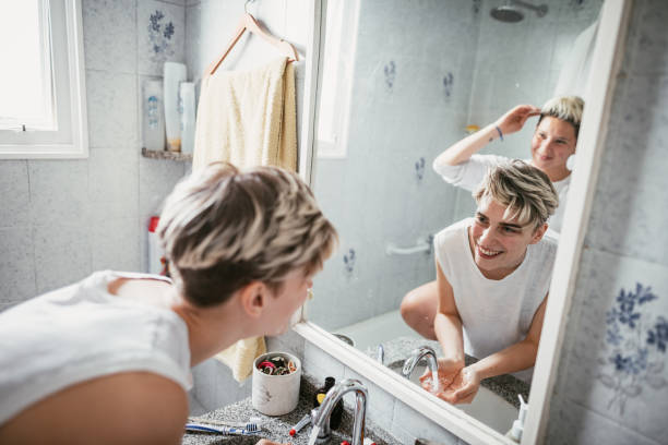 istock Lesbian couple in bathroom in the morning, having morning routine before going to work 1305530034