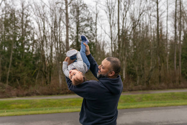 istock Loving dad playing with daughter ouside 1305542110