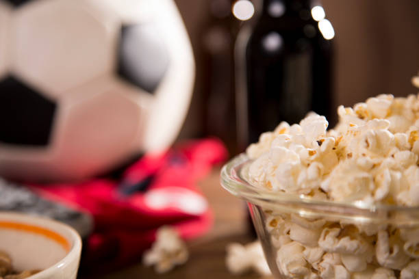 istock Watching the Soccer game with snacks, drinks. 1305543462