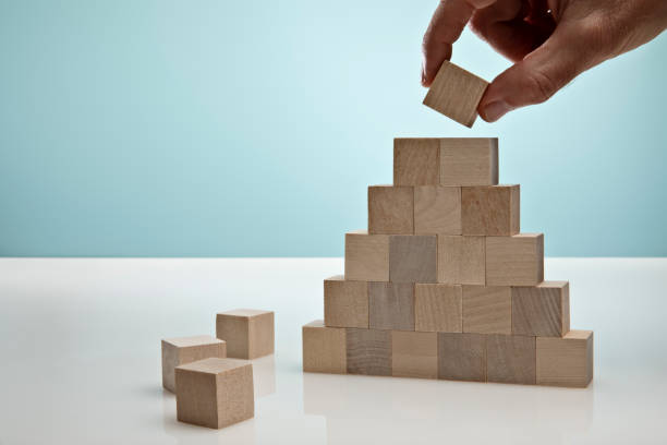 Blocks on Blue Background symbolizing Business Growth