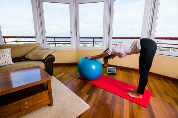 istock Woman at home doing pilates exercises. 1305545261
