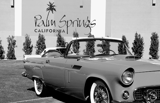 Palm Springs,California, USA- November 18, 2012: Public Square downtown Palm Springs with early 50's model Ford Thunderbird convertible. Palm Springs was the place to be in the mid Century.