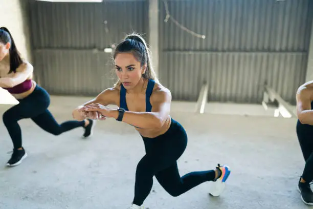 Photo of Latin woman exercising with a cardio workout