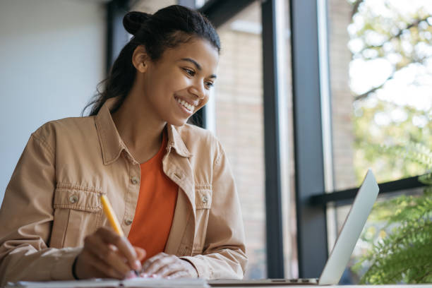 istock African American woman freelancer using laptop working from home 1305551808