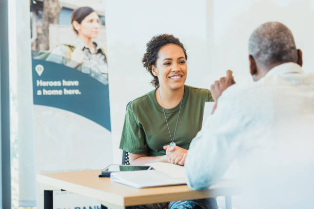 istock Confident soldier talks with bank manager 1305552376