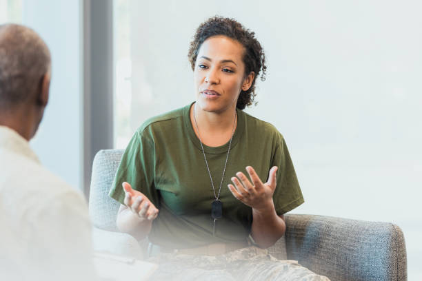 istock Gesturing with her hands, soldier tries to communicate despair 1305552527